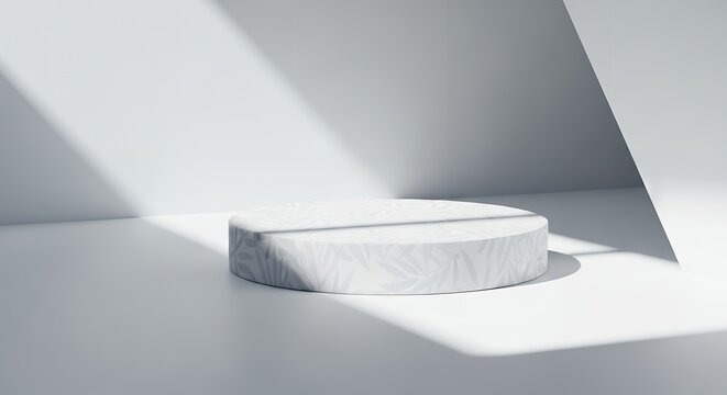 A minimalist white cylinder pedestal with a subtle leaf pattern sits on a light gray floor illuminated by dramatic diagonal shadows cast from the side against a plain white background
