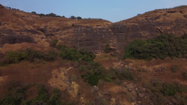 Basalt rock formation, Sahyadri mountain landscape at sunset, Maharashtra, Lonavala, Aerial, closeup