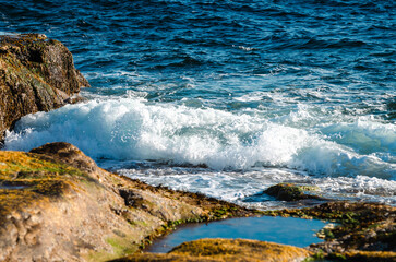 surf waves of clear blue waters of the Arctic Ocean