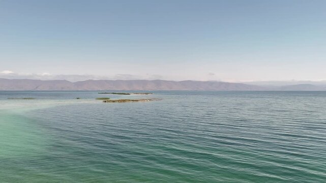 Aerial Drone of Lake Sevan is the largest body of water in both Armenia and the Caucasus region. It is one of the largest freshwater high-altitude (alpine) lakes in Eurasia