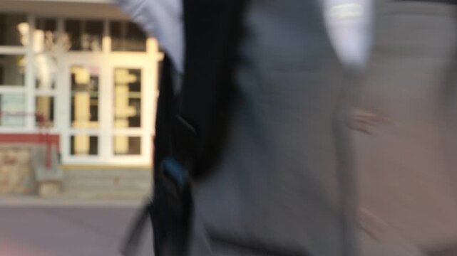 Cute first grade school child, going to school. First day at school for a firstgrader, child starting school, caring backpack