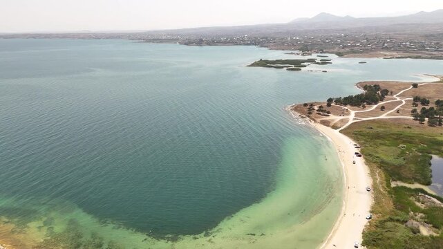 Aerial Drone of Lake Sevan is the largest body of water in both Armenia and the Caucasus region. It is one of the largest freshwater high-altitude (alpine) lakes in Eurasia