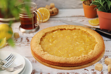 A tart with lemon marmalade served on the table