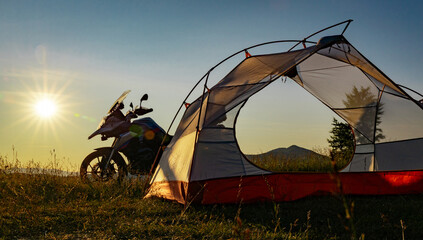 Moto trip on a motorcycle, camping in a tent in the mountains. © Bondariev Volodymyr.