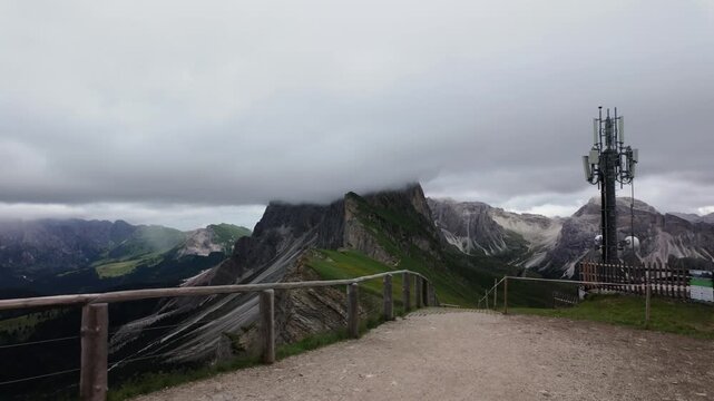 Mountain Trail Leading to Cloud Capped Seceda Peak in the Italian Alps