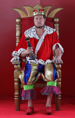 portrait of the king on the throne in the red hall