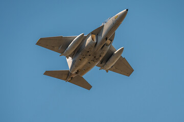 Modern Military Fighter Jet in Flight – Combat Aircraft with Weapons Loadout