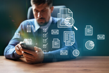 Business professional engaging with mobile technology while managing documents and tasks in a modern office environment