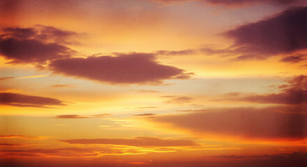 Fototapeta premium Orange sunset sky with clouds background horizontal photo