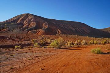 The Red Mountains of Boguta. Mountainous clay terrain. Summer evening time.