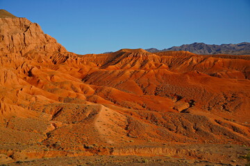 The Red Mountains of Boguta. Mountainous clay terrain. Summer evening time. National Nature Park.