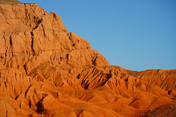 The Red Mountains of Boguta. Mountainous clay terrain. Summer evening time. National Nature Park.
