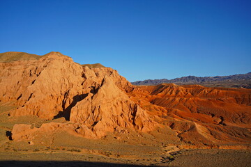 The Red Mountains of Boguta. Mountainous clay terrain. Summer evening time. National Nature Park.