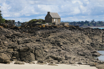 One stone house on the rocks in french Brittany
