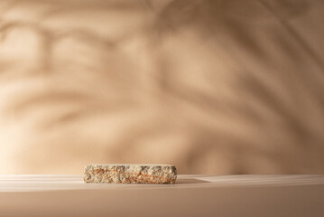Natural Stone Podium with Palm Shadow on Brown Background