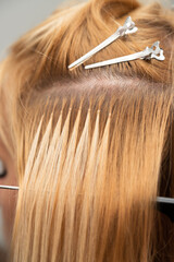 Hair extensions, using capsules, girl at the hairdresser, hair clips, professional equipment