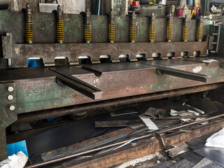 Old Industrial guillotine shear with reinforced blade for metalsheet cut in a structural steel plant