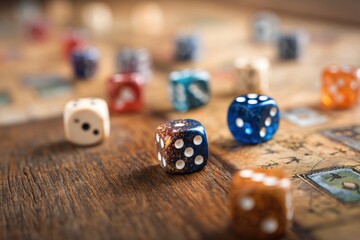 Dice roll on board game, close-up shot on wooden table