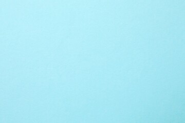 Blue textured sheet background. Empty space for text