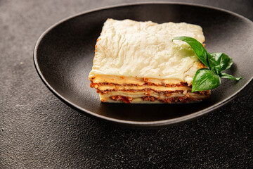 Lasagna bolognese béchamel sauce, meat, cheese second course tasty snack fresh delicious gourmet food background on the table rustic food top view copy space