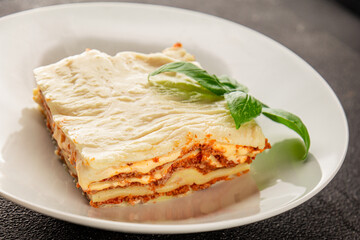 Lasagna bolognese béchamel sauce, meat, cheese second course tasty snack fresh delicious gourmet food background on the table rustic food top view copy space