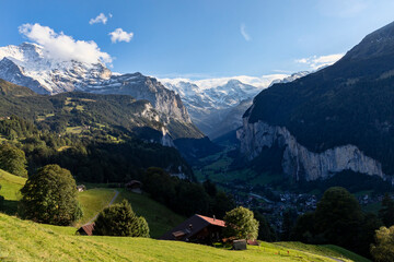 lauterbrunnen valley in the bernese oberland switzerland and the staubbach waterfall seen from wengen early evening
