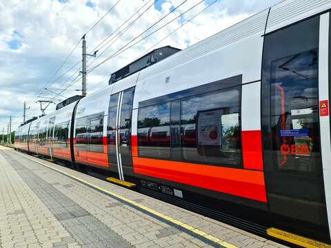 Vienna, Austria - 10. July 2025: Modern OBB train waiting at station platform