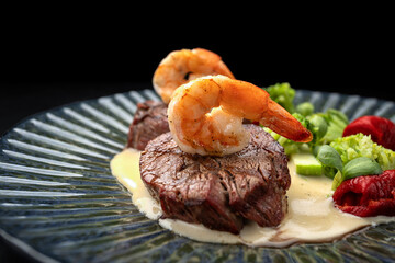 Grilled Meat Medallions with Shrimp, Sauce and Vegetables