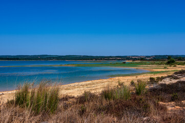 Barragem de Morgavel reservoir with clear blue water in Alentejo Portugal
