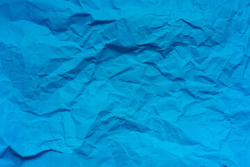 Close-up macro of blue crumpled paper texture,crumpled blue paper background texture close up copy space.