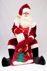 santa claus holding a bag of gifts