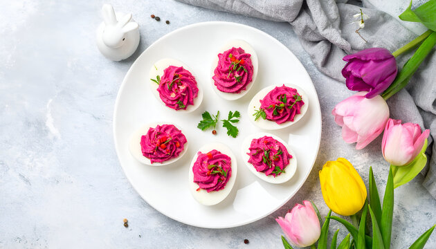 Pink Beetroot Deviled Eggs with Pepper Garnish for Easter