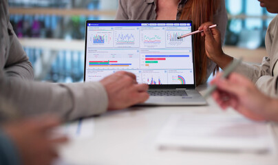 Multicultural Team Analyzing Demographic Data For Financial Predictions