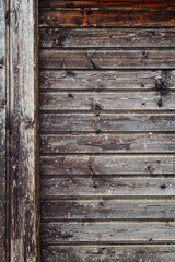 Obraz premium background of old weathered and cracked boards with peeling paint of brown color