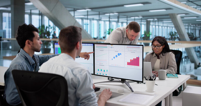 Multiracial Team Analyzing Performance Data