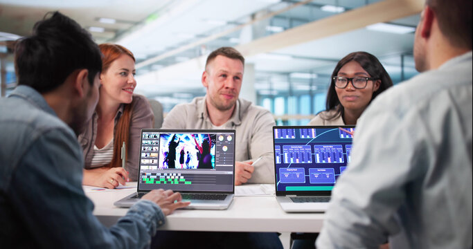 Multiracial Digital Video Editor Creates Montage On Web Software