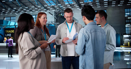 Man Presenting New Technology To Diverse Group
