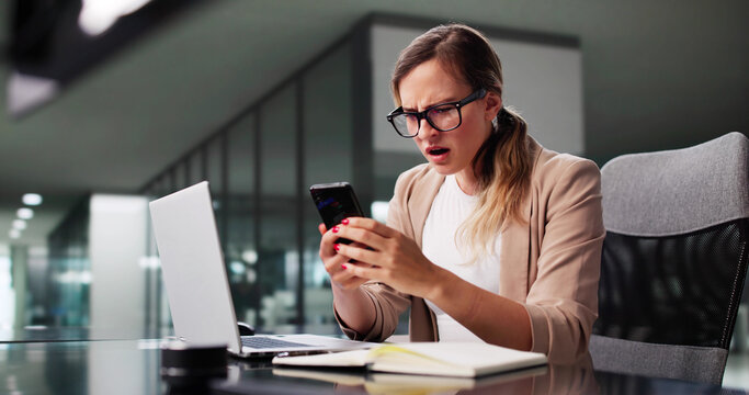 Depressed Businesswoman Scrolling Through Smartphone - Powered by Adobe