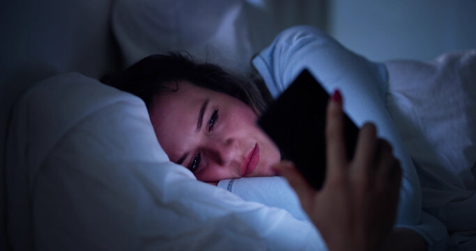 Late-Night Smartphone Obsession: Woman Struggles