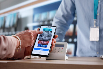Woman Using Cell Phone To Make NFC Payment
