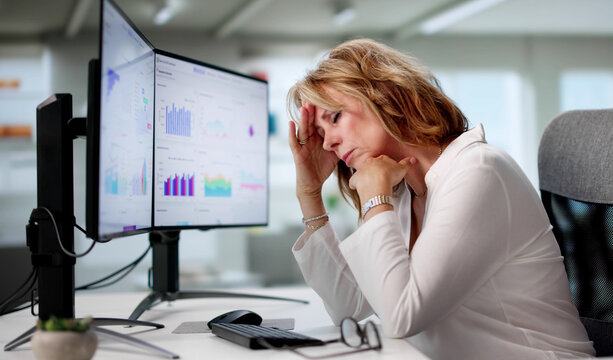 Sad Elderly Woman Overwhelmed By Budget