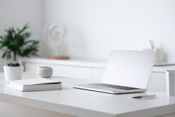 Modern Minimalist Workspace: Laptop, Book, and Greenery on White Desk, Promoting Productivity and Calm