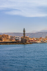 Fototapeta premium Historic lighthouse at the old harbour of Chania Crete