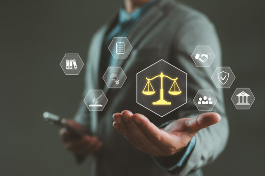 Businessman presenting digital law and justice icons with legal scale, document, and court symbols. Concept of legal technology, compliance, corporate law, regulation and governance system.