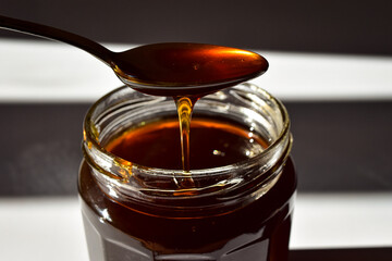 honey dripping from a spoon