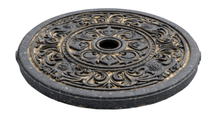 Ornate, circular stone disc. Detailed carvings, intricate design, decorative, antique aesthetic
