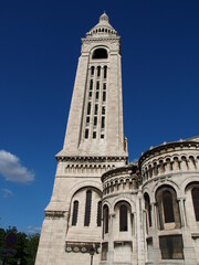 Paris, France – Bell tower of Sacré-Cœur Basilica in Montmartre against blue sky