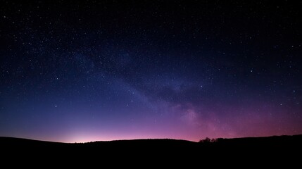 Fototapeta premium Beautiful cloudless night sky with stars and soft blue-purple gradient, captured in panorama with wide angle and long exposure at sunset, boasting high resolution and a peaceful atmosphere.