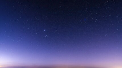 Beautiful cloudless night sky with stars and soft blue-purple gradient, captured in panorama with wide angle and long exposure at sunset, boasting high resolution and a peaceful atmosphere.
