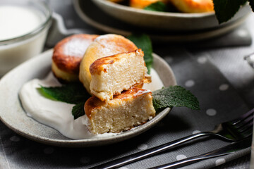 sirniki. Homemade cottage cheese pancakes with sour cream